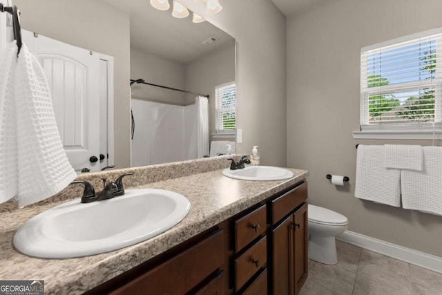 1929 Windstone Pl, Winder, GA 30680 - bathroom with a sink, tile patterned flooring, toilet, and double vanity