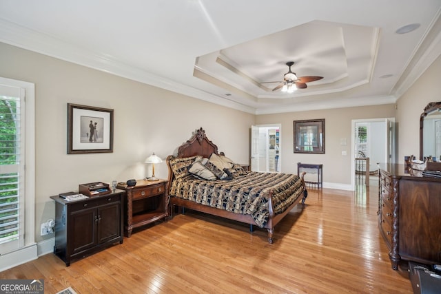 201 Wilderness Knl, Big Canoe, GA 30143 - bedroom featuring light wood-type flooring, ornamental molding, a raised ceiling, and multiple windows