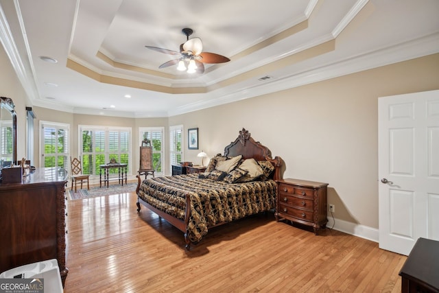 201 Wilderness Knl, Big Canoe, GA 30143 - bedroom featuring a raised ceiling, baseboards, light wood-type flooring, visible vents, and ornamental molding