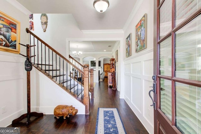1040 Peyton View Ct, Alpharetta, GA 30004 - entryway with arched walkways, stairway, ornamental molding, a decorative wall, and dark wood-type flooring