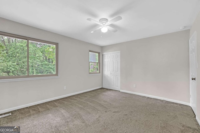2551 Park Rd SE, Smyrna, GA 30080 - carpeted empty room featuring baseboards, ceiling fan, and visible vents