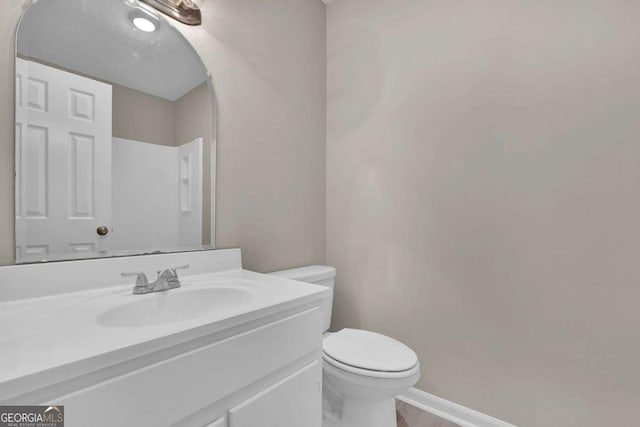 2551 Park Rd SE, Smyrna, GA 30080 - bathroom with toilet, baseboards, and vanity