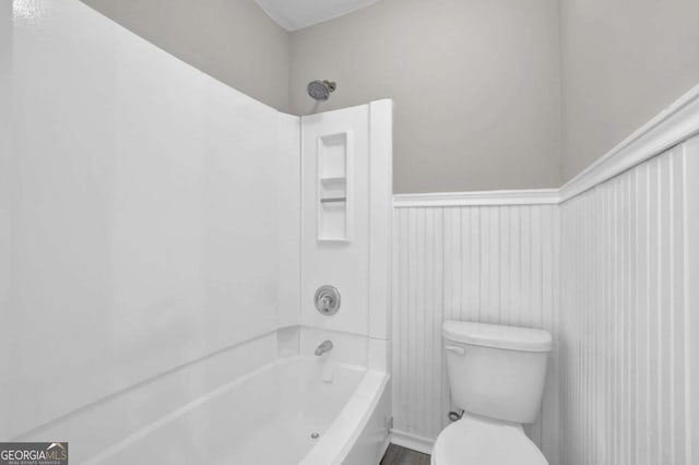 2551 Park Rd SE, Smyrna, GA 30080 - full bath with bathing tub / shower combination, wainscoting, and toilet