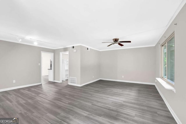 2551 Park Rd SE, Smyrna, GA 30080 - unfurnished living room featuring ceiling fan, ornamental molding, dark wood-style flooring, and visible vents