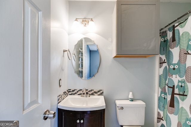 447 Wallace Way, Rockmart, GA 30153 - bathroom with vanity, toilet, curtained shower, and tasteful backsplash
