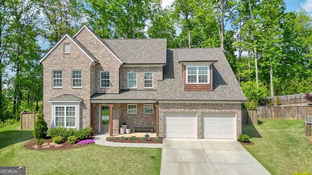 242 Fieldbrook Xing, Canton, GA 30115 - traditional-style house featuring a front lawn, roof with shingles, and fence