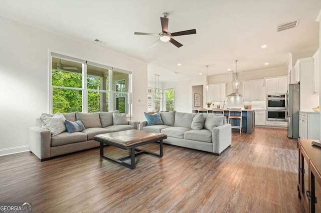 242 Fieldbrook Xing, Canton, GA 30115 - living area with dark wood-type flooring, a ceiling fan, visible vents, and recessed lighting
