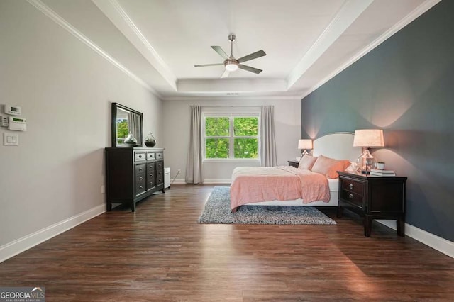 242 Fieldbrook Xing, Canton, GA 30115 - bedroom with a tray ceiling, ornamental molding, baseboards, and dark wood-type flooring