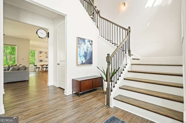 242 Fieldbrook Xing, Canton, GA 30115 - stairs featuring baseboards and wood finished floors