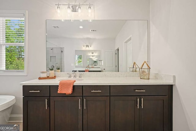 242 Fieldbrook Xing, Canton, GA 30115 - bathroom featuring visible vents, a shower stall, a healthy amount of sunlight, and vanity