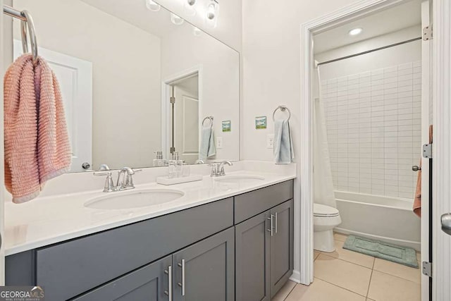 242 Fieldbrook Xing, Canton, GA 30115 - full bath featuring double vanity, toilet, tile patterned floors, and a sink