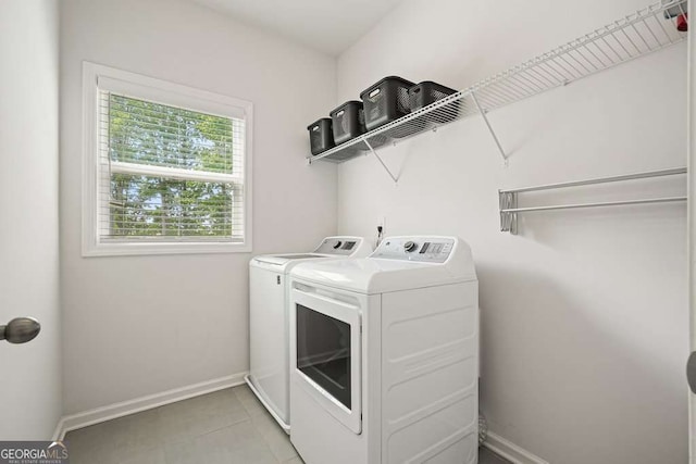 242 Fieldbrook Xing, Canton, GA 30115 - laundry area with light tile patterned floors, separate washer and dryer, baseboards, and laundry area