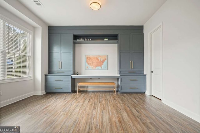 242 Fieldbrook Xing, Canton, GA 30115 - interior space featuring baseboards, visible vents, wood finished floors, and built in study area