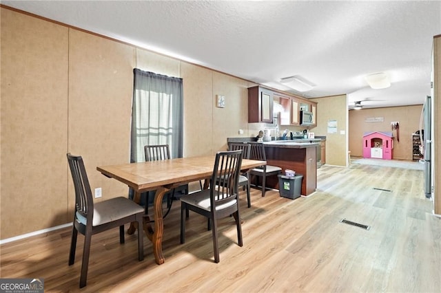 1575 Davis Rd W, Fairmount, GA 30139 - dining room with light wood-type flooring and a textured ceiling