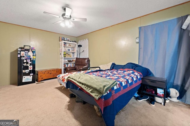 bedroom with carpet floors, a textured ceiling, and ceiling fan