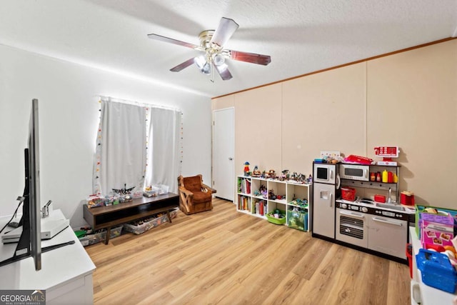 game room featuring ceiling fan and light wood finished floors