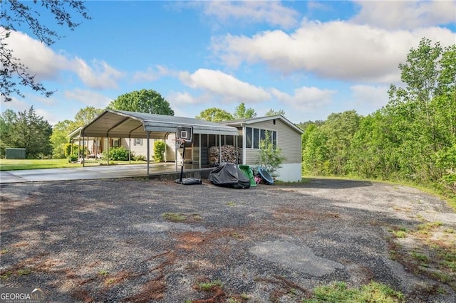 1575 Davis Rd W, Fairmount, GA 30139 - manufactured / mobile home featuring concrete driveway and a carport