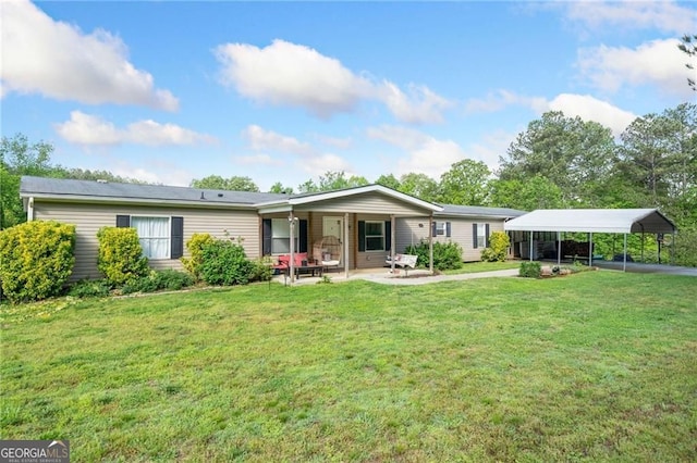 1575 Davis Rd W, Fairmount, GA 30139 - rear view of house with a carport and a lawn