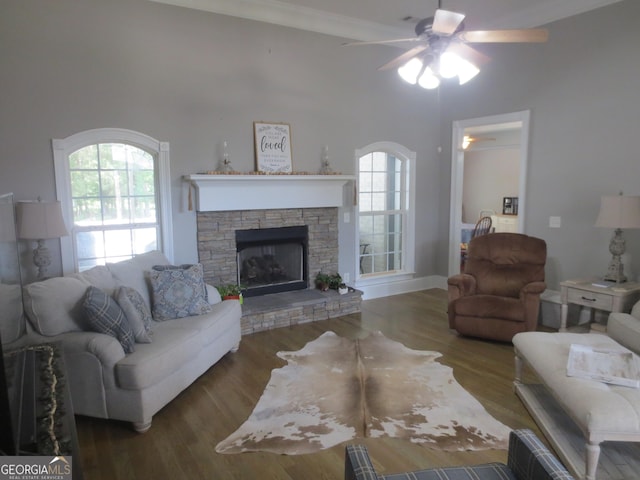 105 Wieland Dr, Kathleen, GA 31047 - living area featuring ceiling fan, a stone fireplace, wood finished floors, and a wealth of natural light