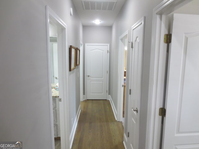 105 Wieland Dr, Kathleen, GA 31047 - hallway with visible vents, dark wood-style flooring, and baseboards