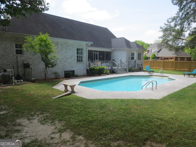 105 Wieland Dr, Kathleen, GA 31047 - view of swimming pool featuring fence, a fenced in pool, a wooden deck, and a yard