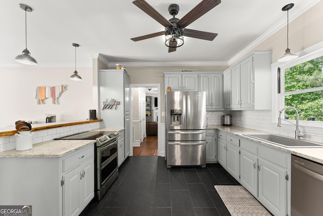 1536 Enota Ave NE, Gainesville, GA 30501 - kitchen with stainless steel appliances, ceiling fan, backsplash, ornamental molding, and dark tile patterned flooring