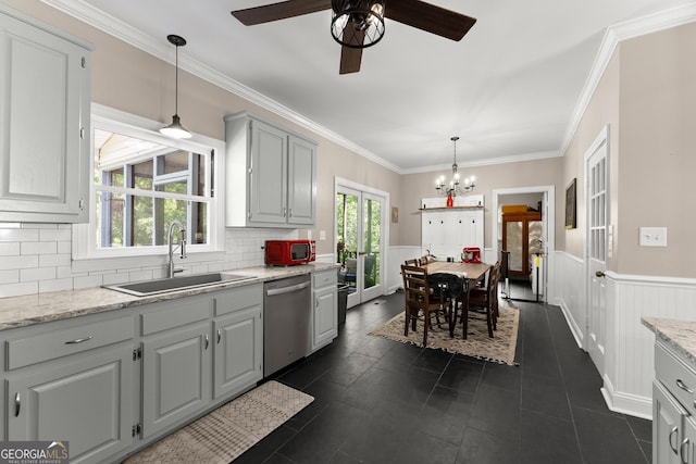 1536 Enota Ave NE, Gainesville, GA 30501 - kitchen featuring dishwasher, a ceiling fan, a wainscoted wall, a chandelier, and decorative backsplash