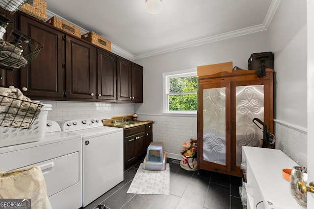 1536 Enota Ave NE, Gainesville, GA 30501 - laundry room with cabinet space, separate washer and dryer, tile walls, ornamental molding, and a wainscoted wall