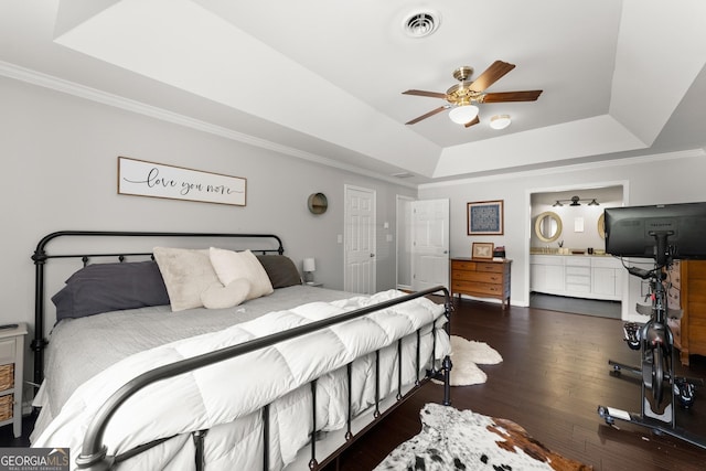 1536 Enota Ave NE, Gainesville, GA 30501 - bedroom featuring a raised ceiling, ornamental molding, wood finished floors, connected bathroom, and a ceiling fan
