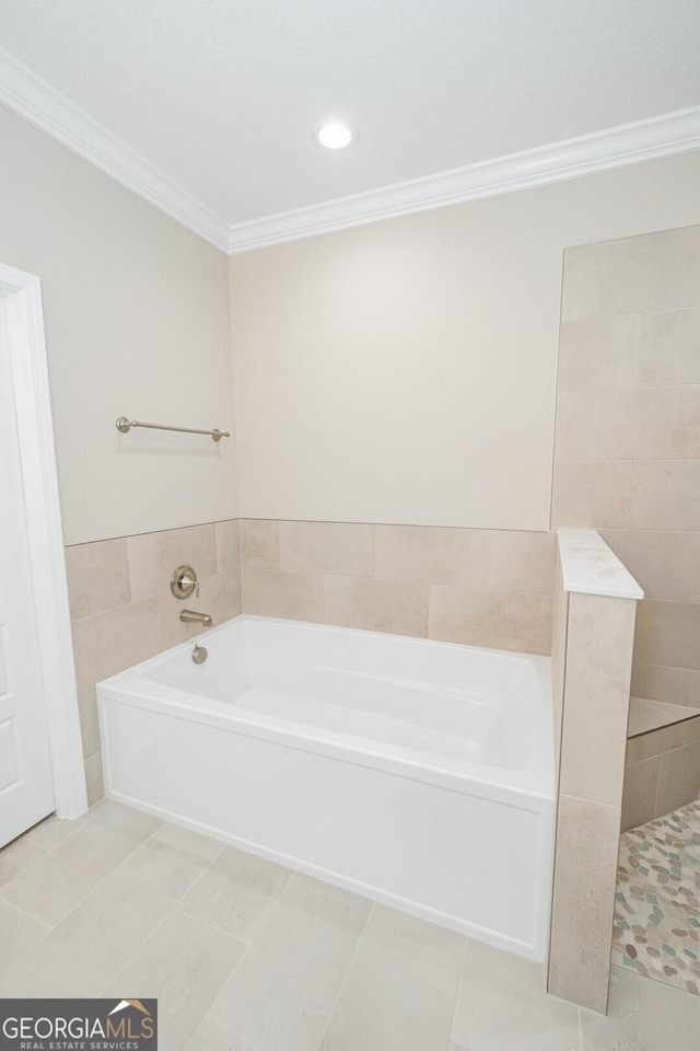 bathroom featuring crown molding, tile patterned flooring, and a bath
