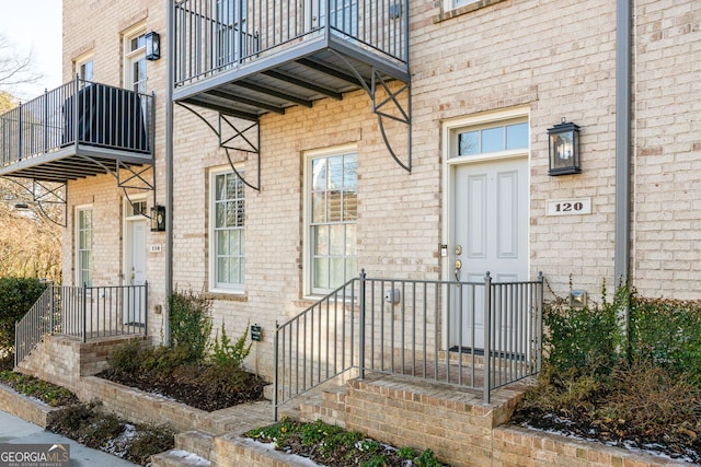 120 Clover Ct, Roswell, GA 30075 - view of exterior entry with a balcony and brick siding