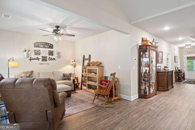 living room with visible vents, wood finished floors, baseboards, ceiling fan, and recessed lighting