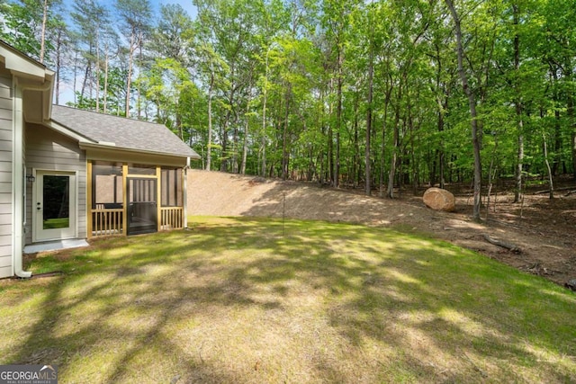 view of yard featuring a sunroom
