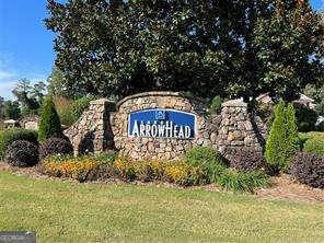 community sign with a lawn