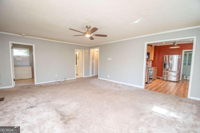 unfurnished living room with crown molding, baseboards, light carpet, and a ceiling fan