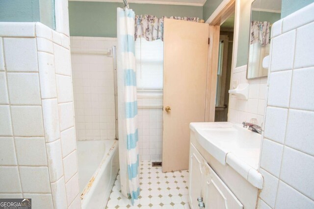 522 Park Ave, Lagrange, GA 30240 - full bathroom featuring wainscoting, shower / bath combo, vanity, tile patterned floors, and tile walls