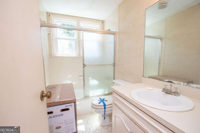 522 Park Ave, Lagrange, GA 30240 - full bathroom featuring vanity, tile patterned flooring, combined bath / shower with glass door, and toilet
