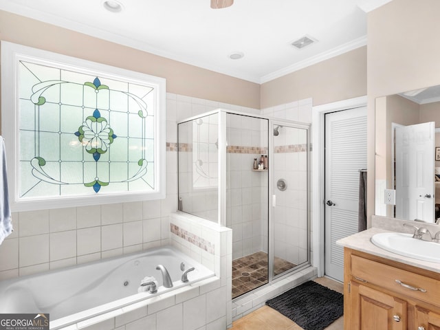 full bathroom with a stall shower, a tub with jets, vanity, and visible vents