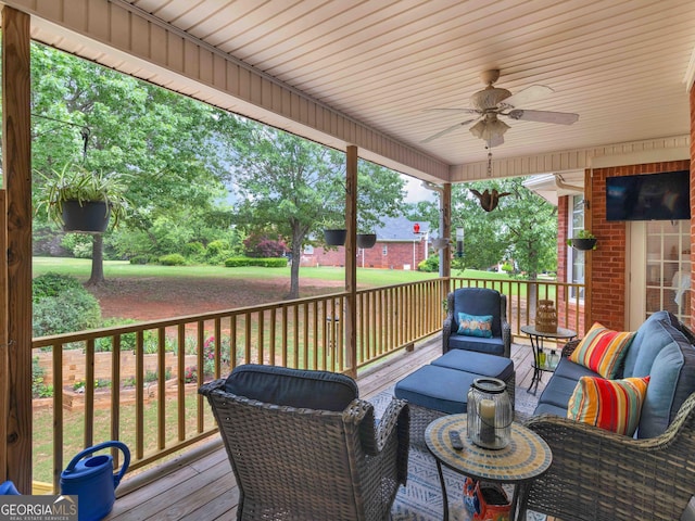 deck featuring an outdoor hangout area and a ceiling fan