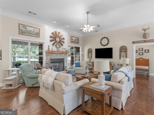 living room with crown molding and plenty of natural light