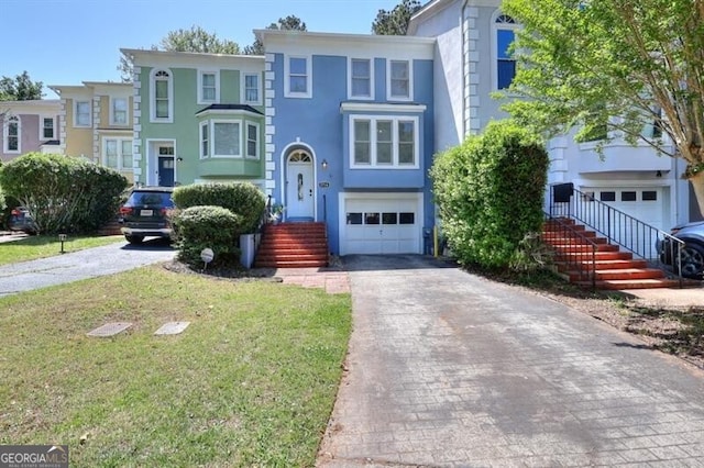 3716 Meeting St, Duluth, GA 30096 - view of front of property with an attached garage, stucco siding, a front lawn, and aphalt driveway