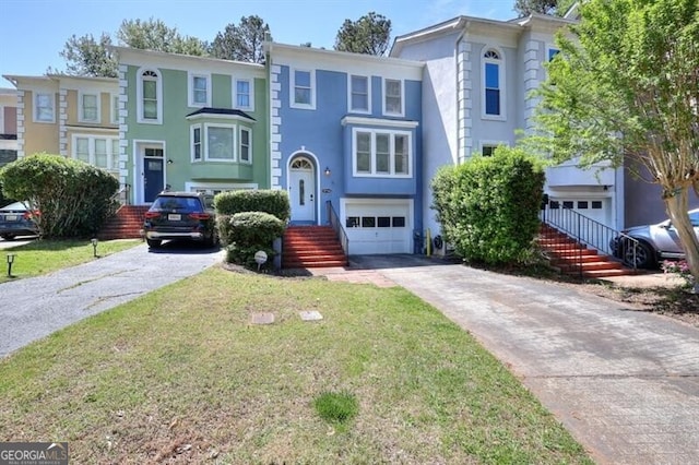 3716 Meeting St, Duluth, GA 30096 - view of front of home featuring concrete driveway, stucco siding, a garage, and a front lawn