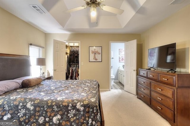 3716 Meeting St, Duluth, GA 30096 - bedroom featuring light colored carpet, a walk in closet, connected bathroom, and visible vents