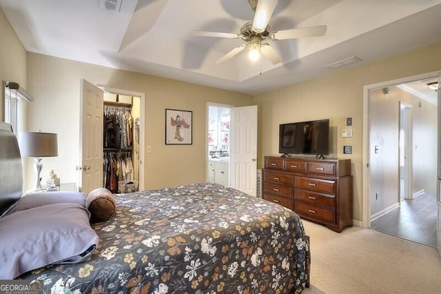 3716 Meeting St, Duluth, GA 30096 - bedroom with a closet, visible vents, light carpet, a walk in closet, and a raised ceiling