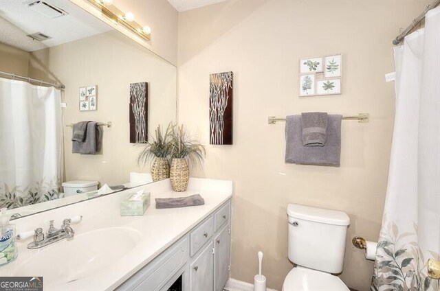 3716 Meeting St, Duluth, GA 30096 - full bathroom with toilet, vanity, and visible vents