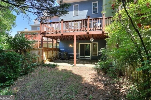 3716 Meeting St, Duluth, GA 30096 - back of property with a patio area, a deck, stucco siding, and fence