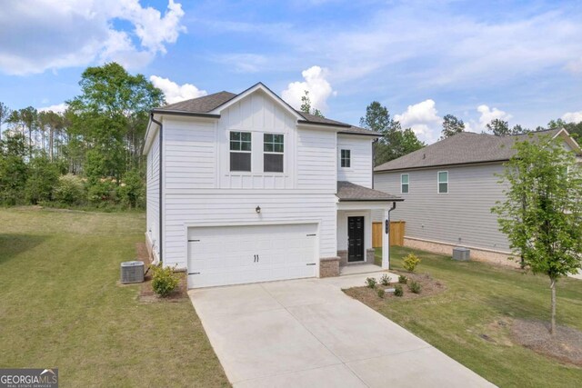 828 Evergreen Rd, Winder, GA 30680 - view of front of house with board and batten siding, a front yard, a garage, central air condition unit, and concrete driveway