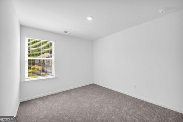 828 Evergreen Rd, Winder, GA 30680 - unfurnished bedroom with baseboards, carpet, and a closet