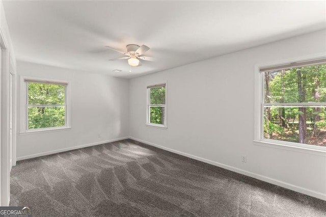 800 Breckinridge Rd SW, Marietta, GA 30064 - unfurnished room with baseboards, ceiling fan, and dark colored carpet