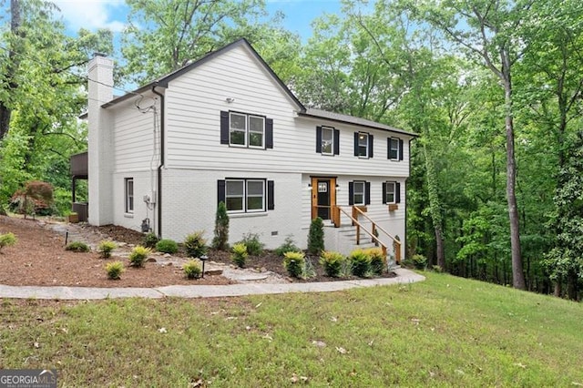 800 Breckinridge Rd SW, Marietta, GA 30064 - view of front facade featuring brick siding, a front lawn, and a chimney